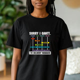 Person wearing a black t-shirt with text in a living room setting