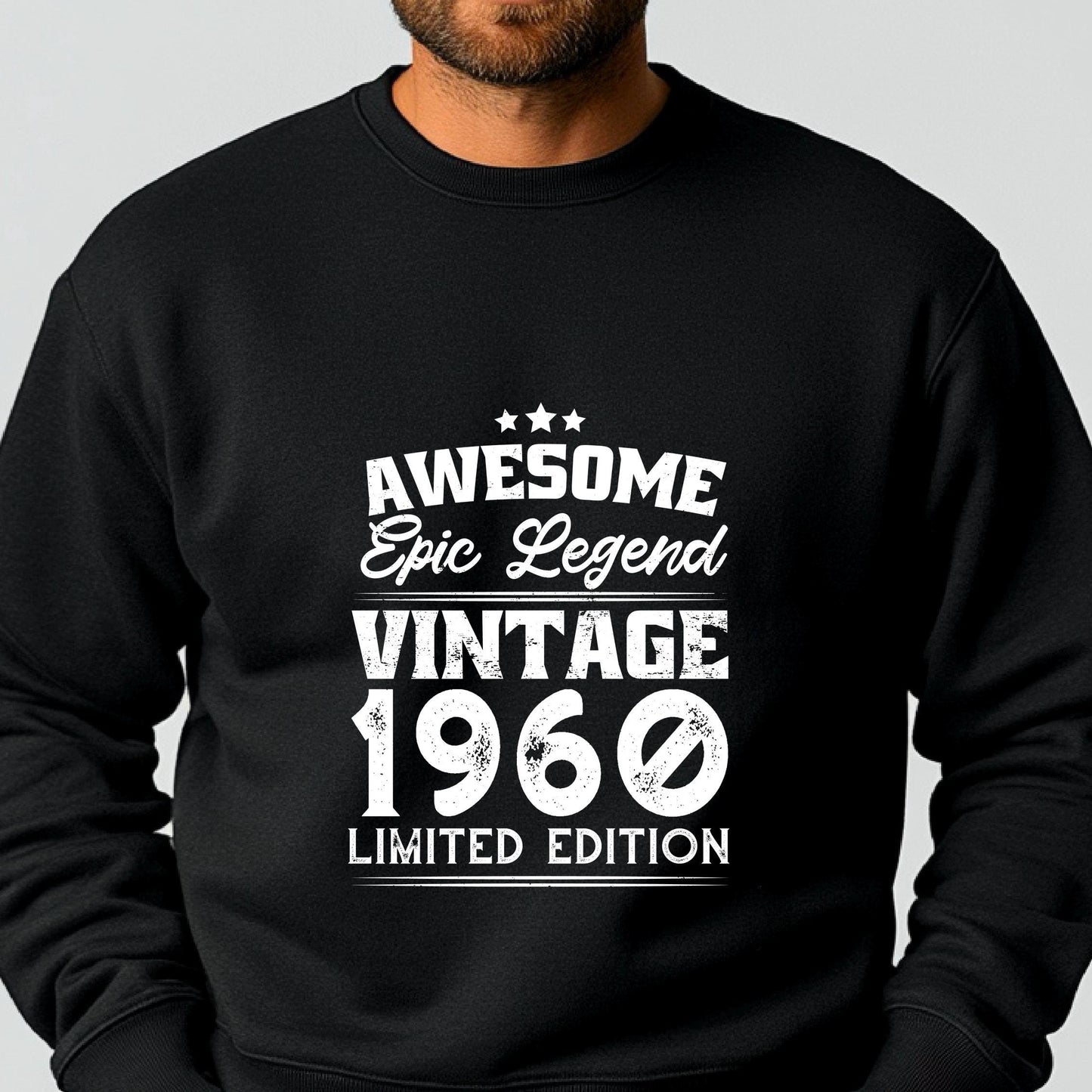 A person wearing a black sweatshirt with white text that reads 'AWESOME Epic Legend VINTAGE 1960 Limited Edition'.
